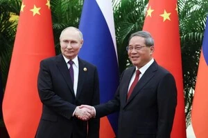 Російський диктатор Володимир Путін та прем'єр Державної ради КНР Лі Цян під час минулої зустрічі