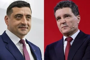 Джордже Сіміон (праворуч) взявся публічно ображати опонента напередодні фіналу виборчих перегонів у Румунії 