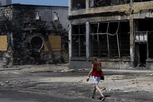 Зруйновані будівлі на вулицях Херсона (червень 2023 року)