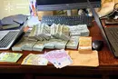 Елітні авто, мільйони готівки. Що вилучено у топпосадовців Нацполіції (фото)