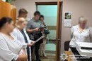 Гроші у коробках з-під тортів: у Києві повідомлено про підозру члену ВЛК та його спільникам