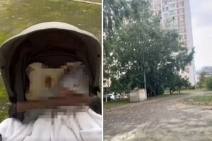 Жінка з немовлям у візочку була змушена чекати під зачиненою будівлею в момент атаки дронів