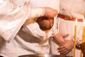 Маленький Святослав на руках у хрещеного 