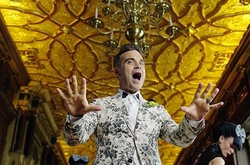 Российские СМИ считают скандальный клип Робби Уильямса провальным