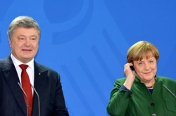 Порошенко запевнив німців, що Україна залишається відданою Мінським угодам