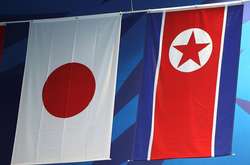 Прапори Японії на КНДР