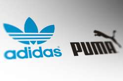 Логотипи компаній Adidas і Puma