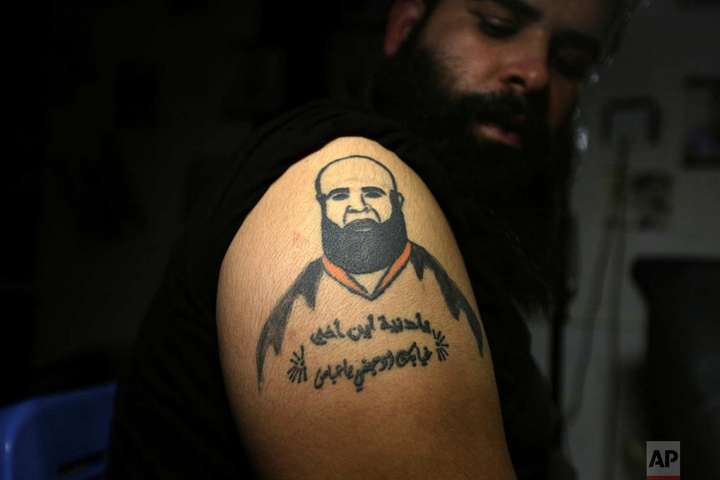 Иракцы делают татуировки, чтобы скрыть шрамы войны. Фотогалерея