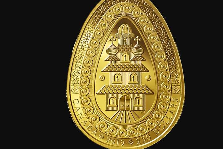 <p>На монеті зображено дерев’яний український храм</p> - У Канаді вперше випустили золоту монету у формі української писанки