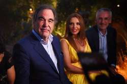 Олівер Стоун (зліва), Оксана Марченко та Ігор Лопатьонок на відкритті кінофестивалю в Таорміне