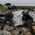 <p>Пророссийские боевики на месте катастрофы рейса МН17</p>