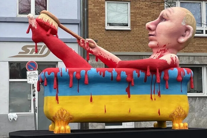 По шию у крові: вулицями німецьких міст проїхався диктатор Путін (фото, відео)