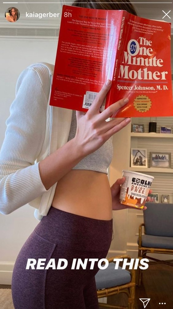 kaia-gerber-posts-cryptic-photo-reading-pregnancy-book
